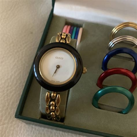 gucci watch changeable bezels.